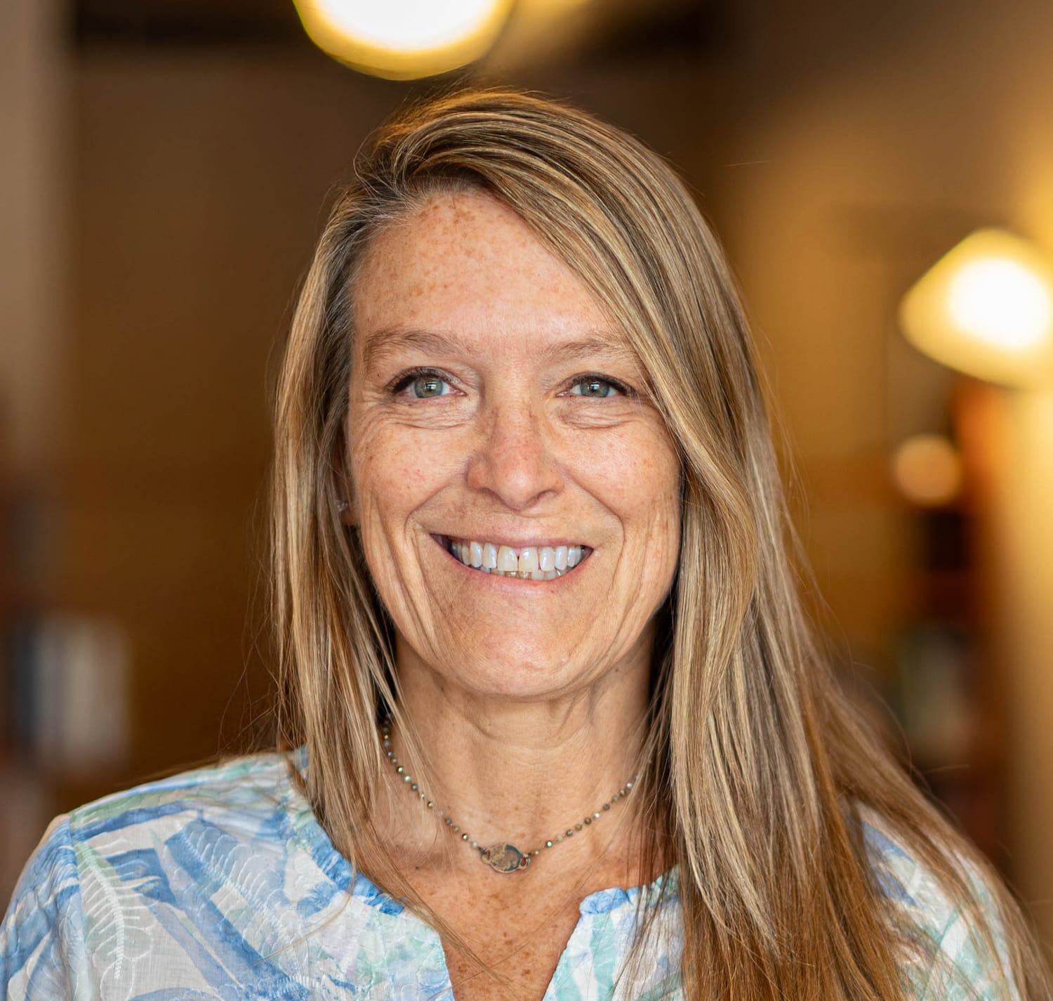 Portrait of Kimberlee Grogan, sound meditation practitioner in Duluth, MN. Kimberlee has an intuitively guided process