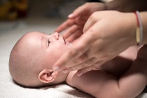 Occupational therapy duluth mn. A baby receives craniosacral therapy massage during a pediatric massage