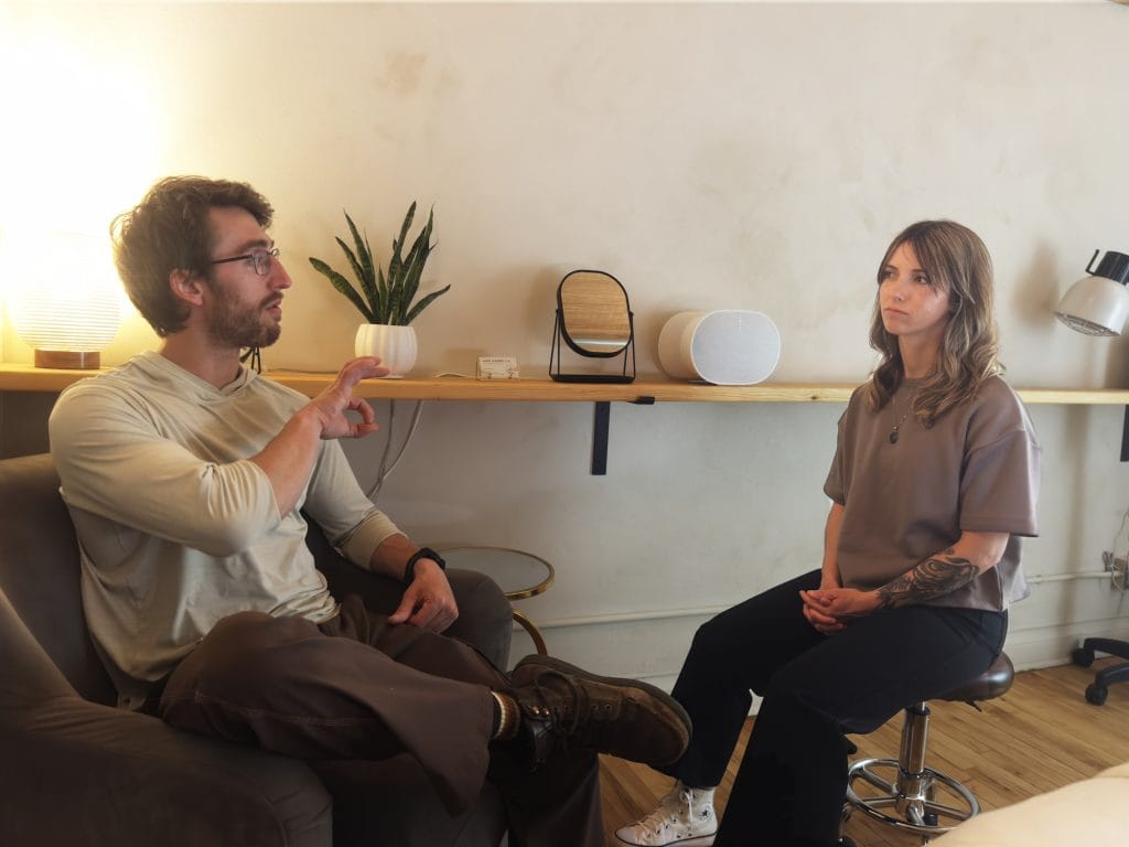 Acupuncturist Jakki Overby reviews a client's health history, past health issues, and current treatment goals.